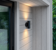 Light grey composite cladding installed around a modern doorway