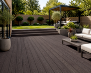 Coffee composite decking in a landscaped garden with a pergola