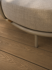 Close-up of teak composite decking beneath outdoor seating