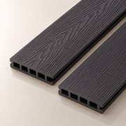 Two coffee composite decking boards on a light background