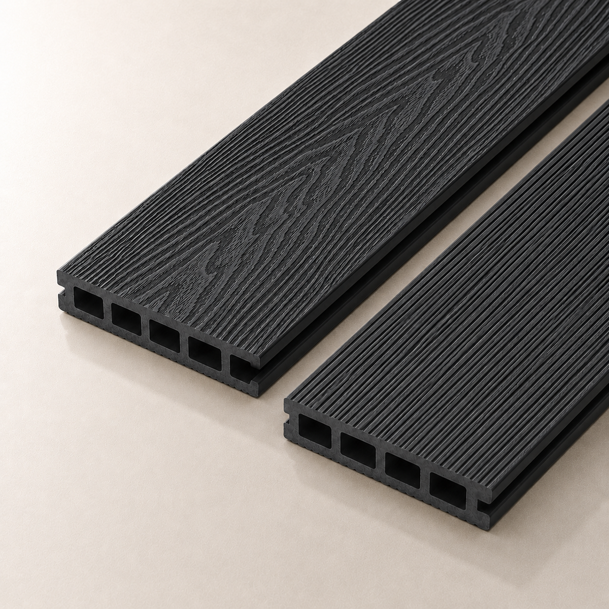 Two charcoal composite decking boards on a light background