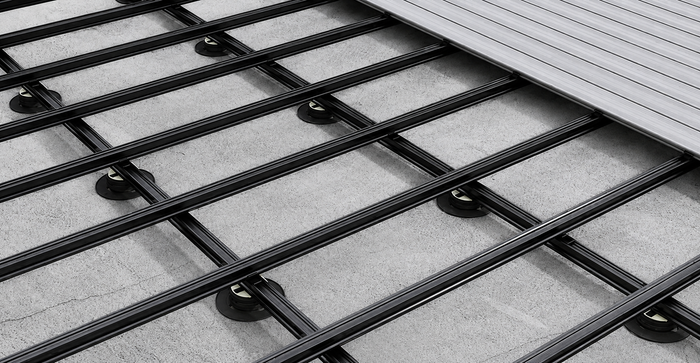 Black composite joists installed beneath decking boards