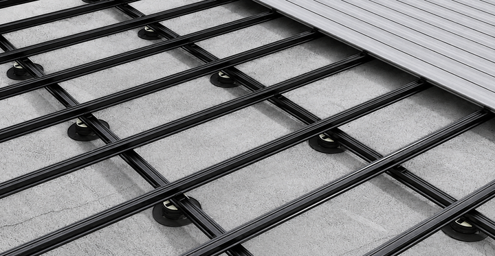 Black composite joists installed beneath decking boards
