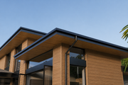 Teak composite cladding on a contemporary glazed house
