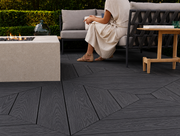 Close-up of charcoal composite decking beside outdoor seating