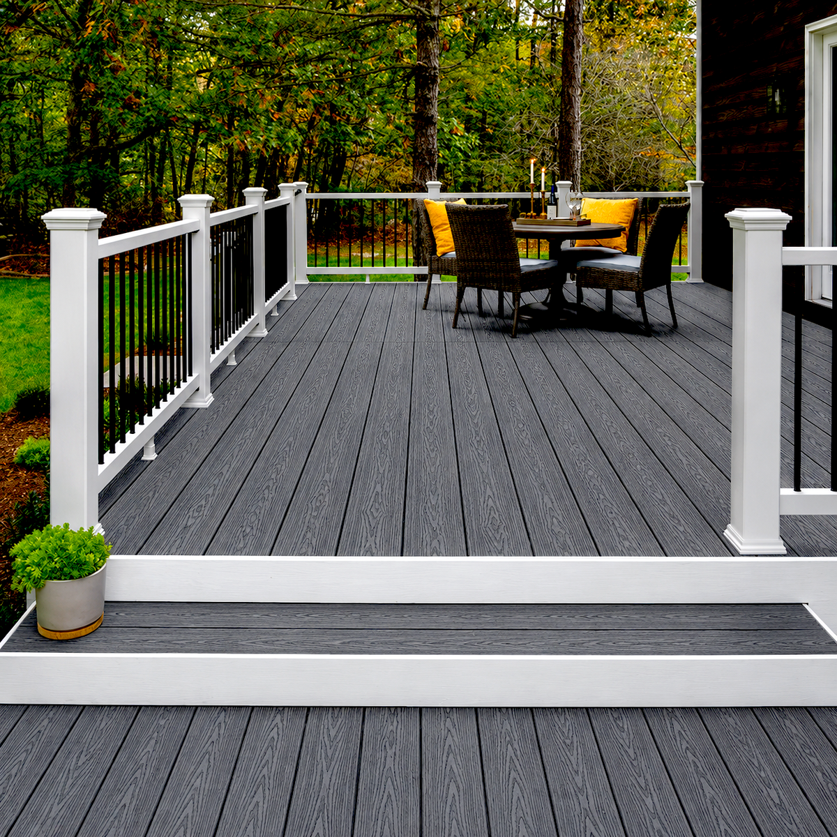 Dark grey composite decking on a raised terrace with white railings