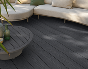 Close-up of dark grey composite decking beside outdoor seating