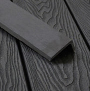 Dark grey composite L trim positioned on matching decking