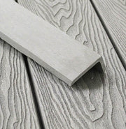 Light grey composite L trim positioned on matching decking
