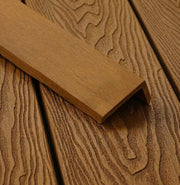 Teak composite L trim positioned on matching decking