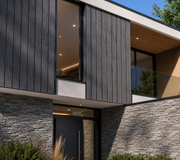 Dark grey composite cladding on a contemporary house exterior