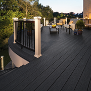 Charcoal composite decking on a raised terrace with railings