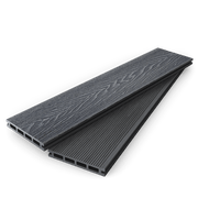 Stacked dark grey composite decking boards showing woodgrain and grooved faces