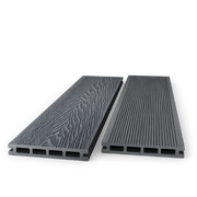 Two dark grey composite decking boards showing woodgrain and grooved faces