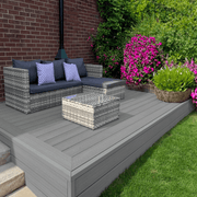 Raised dark grey composite deck with garden seating and planting