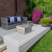 Raised light grey composite deck with garden seating and planting