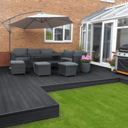 Charcoal composite deck with garden seating and a parasol