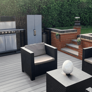Light Grey composite decking with an outdoor kitchen and seating