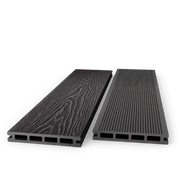 Two charcoal composite decking boards showing woodgrain and grooved faces