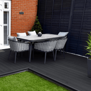 Charcoal composite decking with garden dining furniture