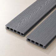Two light grey composite decking boards on a light background