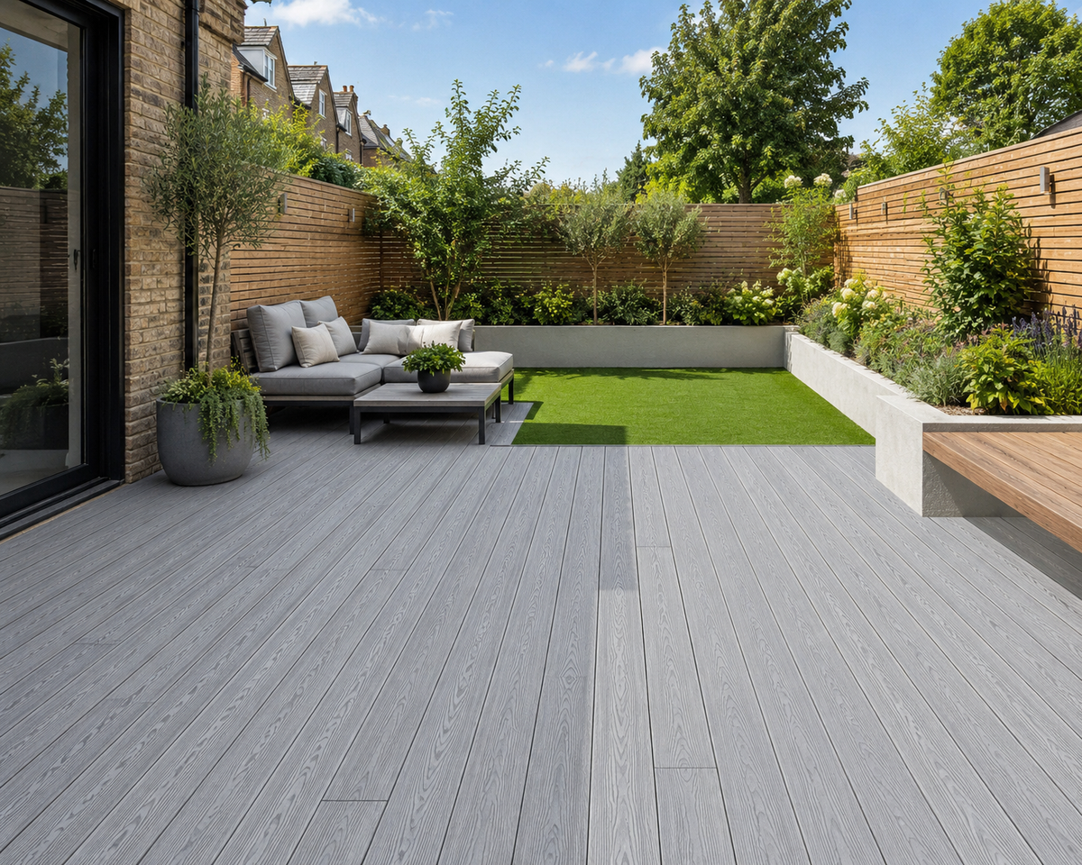 Light grey composite decking in a landscaped garden seating area