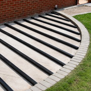 Black composite joists laid for a curved decking installation